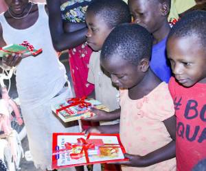 Love Uganda Foundation children receiving their Christmas gifts.